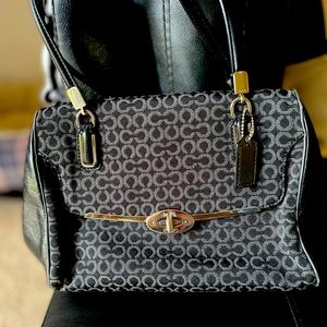 Coach black and White bag with gold hardware.